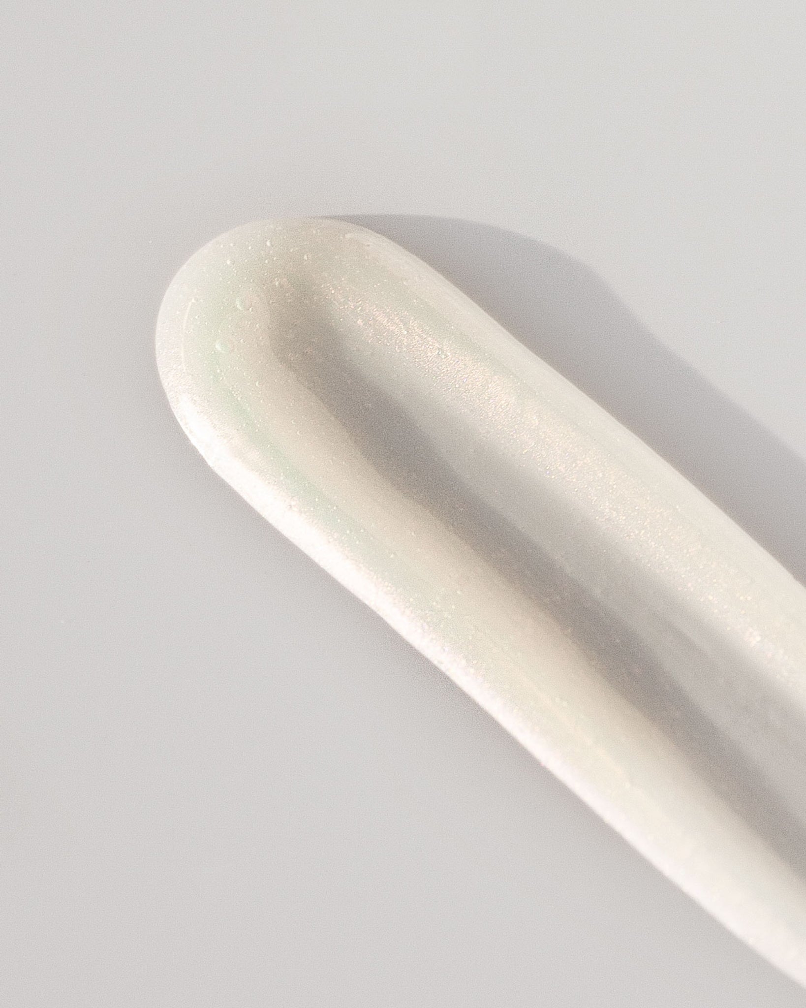 Texture close-up of MΓDARA Organic Skincare skincare remover A2003 οΏ½swatch demonstrates consistency and finish.