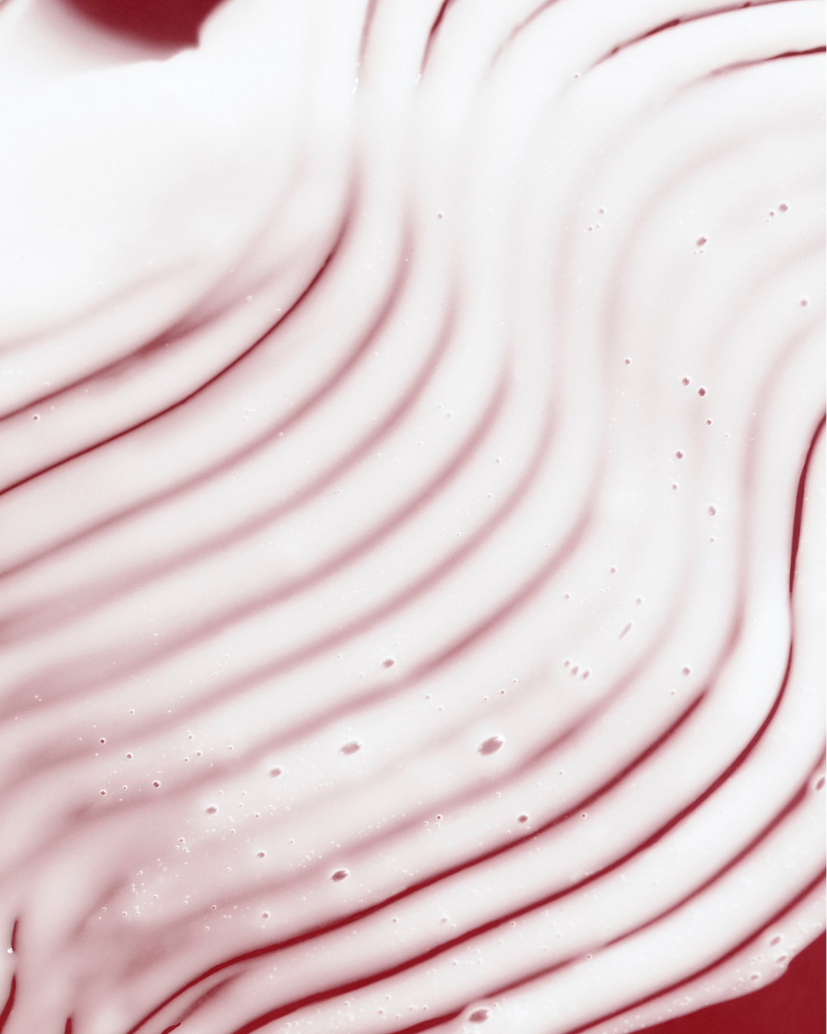 Texture close-up of MÁDARA Organic Skincare derma collagen peptides serum A3061 serum �swatch demonstrates consistency and finish.