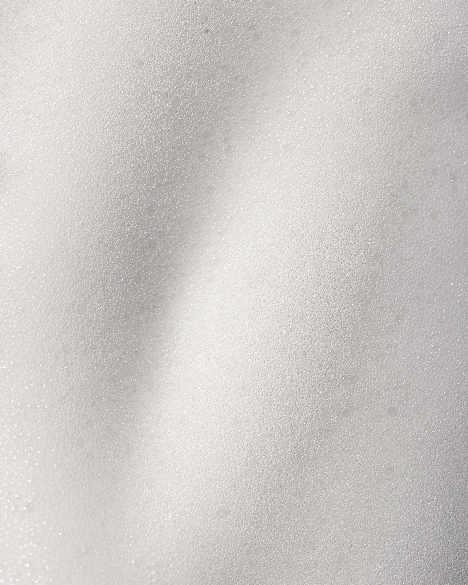 Texture close-up of MÁDARA Organic Skincare makeup remover foam A2001 �swatch demonstrates consistency and finish.