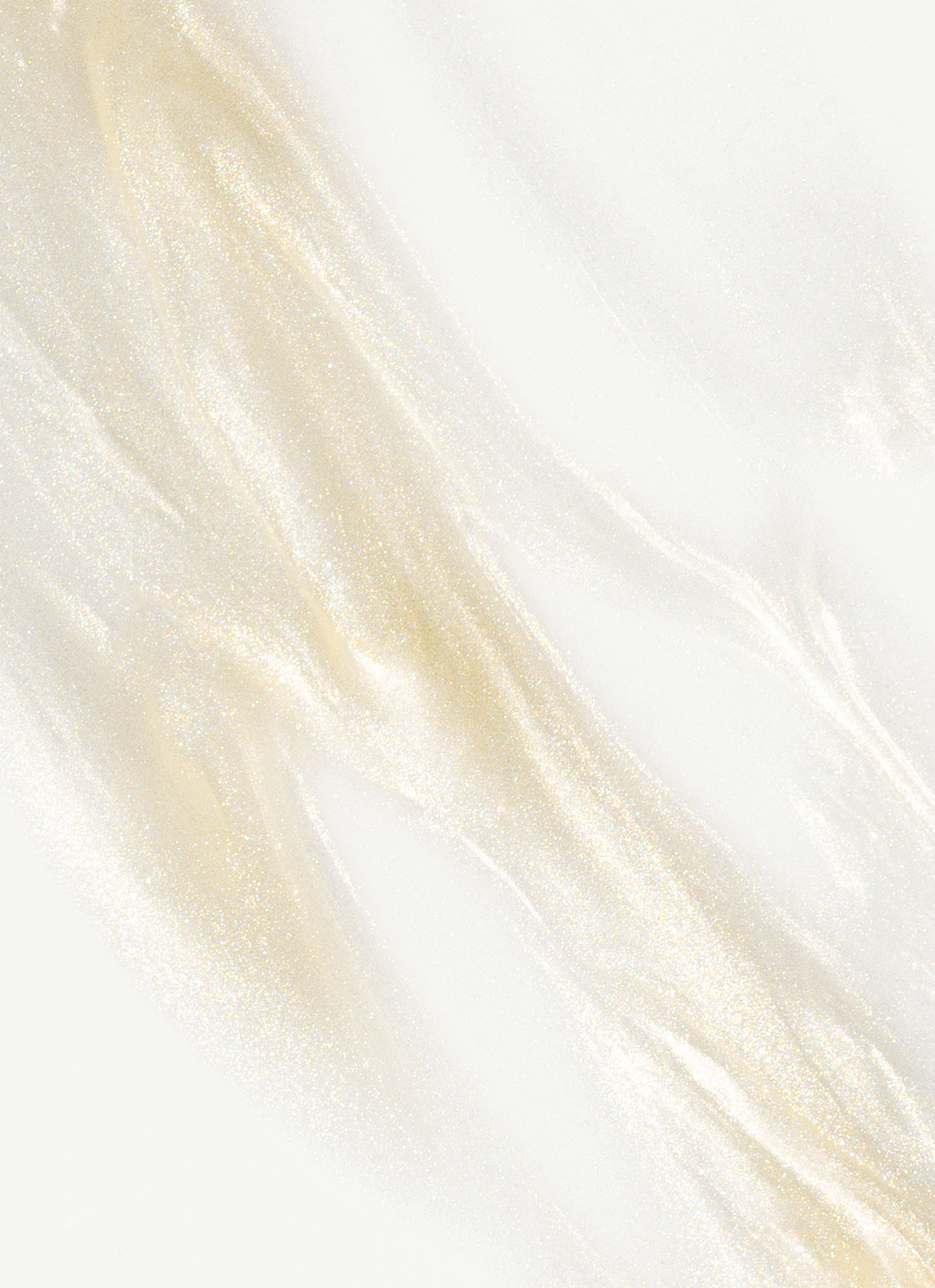 Texture of MÁDARA Hydra Glow Hyaluron Peptide Serum with luminous golden shimmer, highlighting hydrating and radiant organic skincare formula