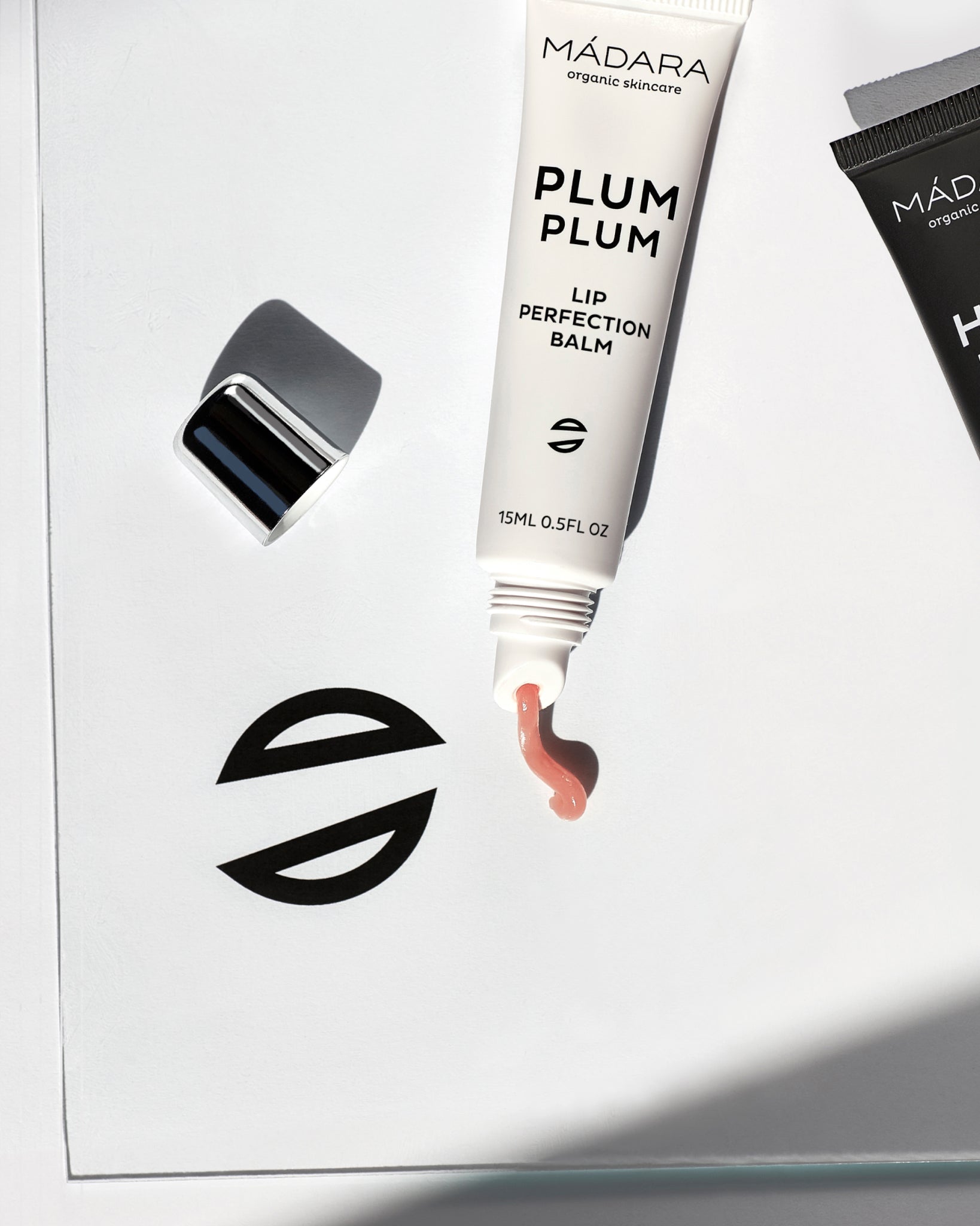 Texture close-up of MÁDARA Organic Skincare lip perfection balm A2291 balm �swatch demonstrates consistency and finish.