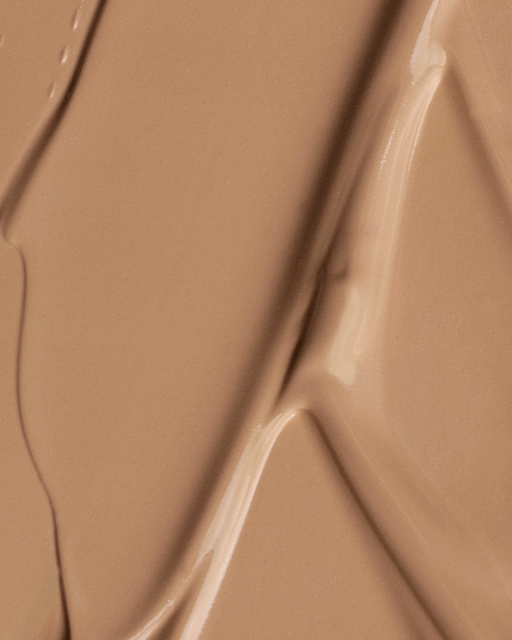 Texture close-up of MÁDARA Organic Skincare the concealer pine A6114 concealer �swatch demonstrates consistency and finish.