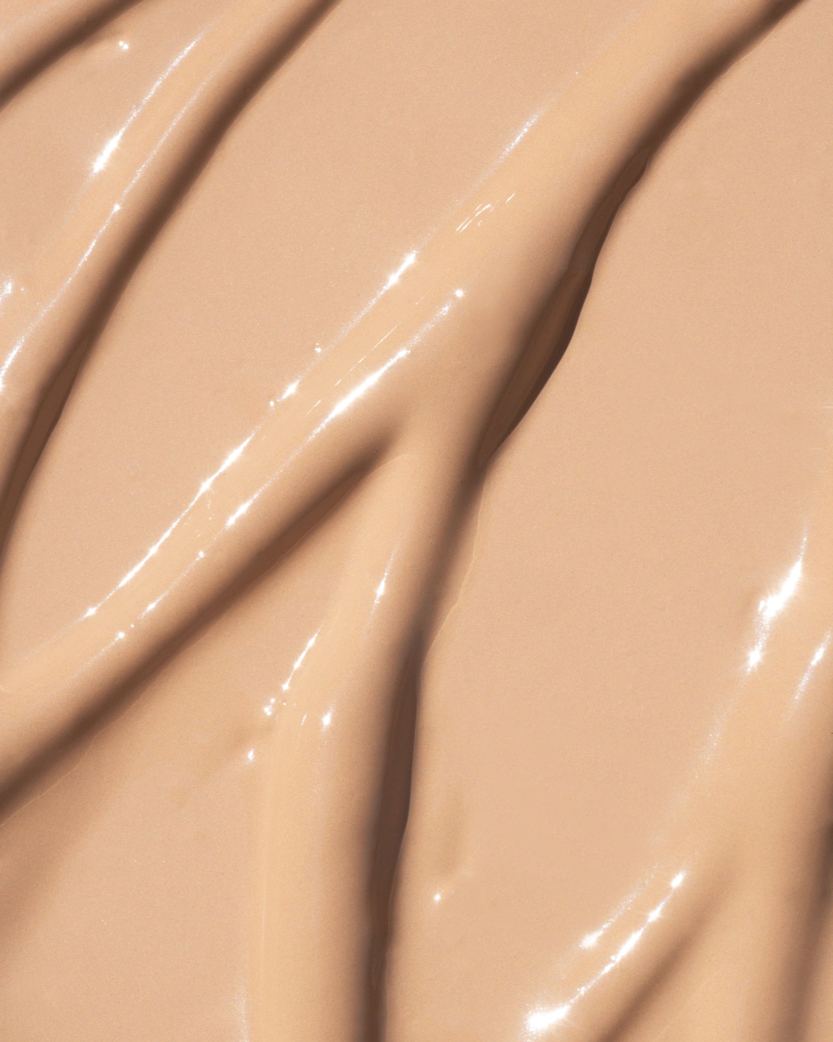 Texture close-up of MÁDARA Organic Skincare the concealer sand A6109 concealer �swatch demonstrates consistency and finish.