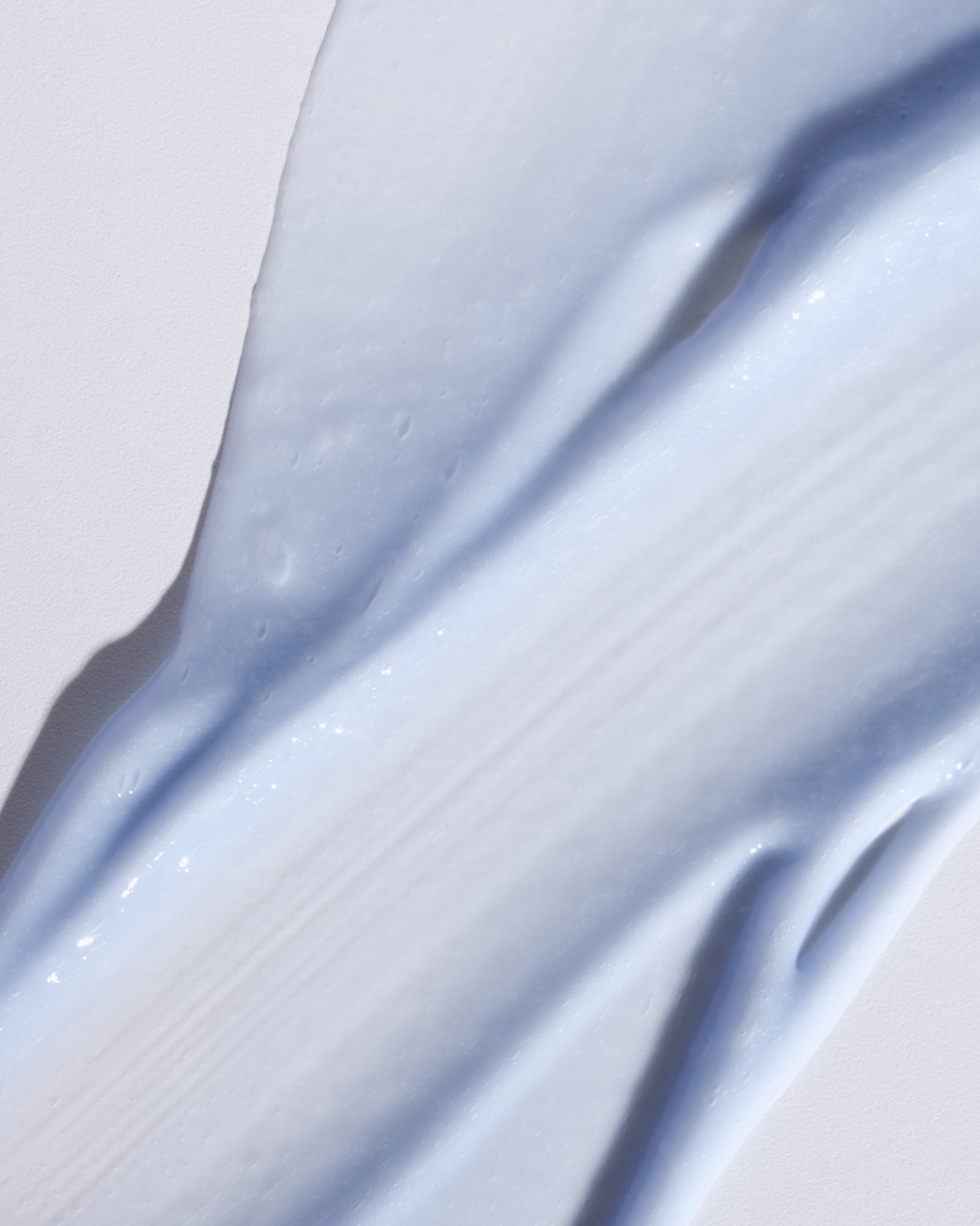 Texture close-up of MÁDARA Organic Skincare plant retinol alternative serum SM3185 15 serum �swatch demonstrates consistency and finish.